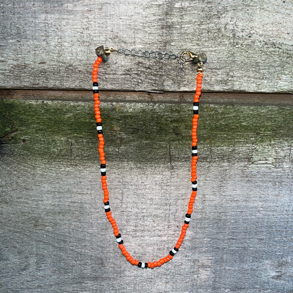 Handmade Orange Beaded Necklace with Black and White Accents